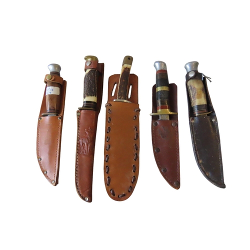 133 - A VINTAGE SOLINGEN ANTLER HANDLED SHEATH KNIFE AND FOUR OTHER SHEATH KNIVES26cms long