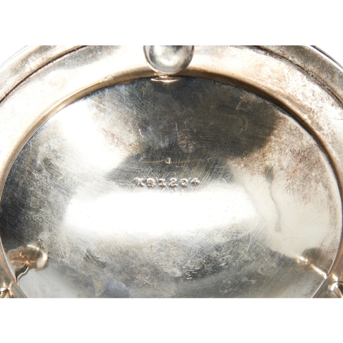 329 - A VINTAGE SILVER TEA STRAINER, the strainer sat upon a galleried circular stand, on ball feet, marke... 