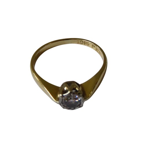 355 - A GOLD SOLITAIRE DIAMOND RING, stamped 18ct on the shank, the diamond held in a decorative settingUK... 