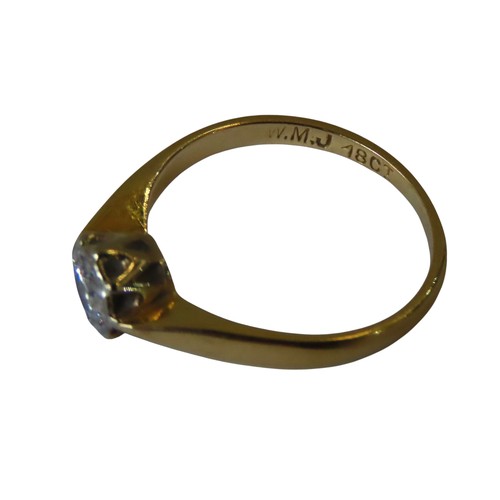 355 - A GOLD SOLITAIRE DIAMOND RING, stamped 18ct on the shank, the diamond held in a decorative settingUK... 