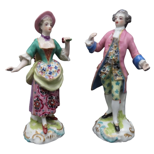 176 - A PAIR OF SAMSON LADY AND GENTLEMAN FIGURES, MID 19TH CENTURY, the lady carrying a basket of grapes ... 