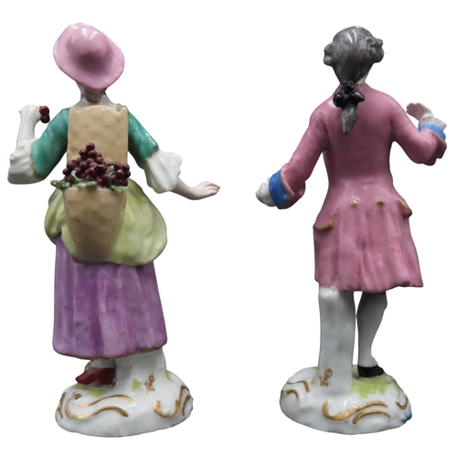 176 - A PAIR OF SAMSON LADY AND GENTLEMAN FIGURES, MID 19TH CENTURY, the lady carrying a basket of grapes ... 