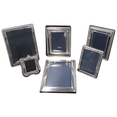 331 - A GROUP OF SIX SILVER MOUNTED PHOTO FRAMES, 20TH CENTURY, various sizes and styles including a small... 