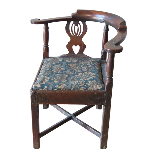 2 - A OAK 19TH CENTURY CORNER CHAIR, the scrolling right angled top rail raised on irregular lyre form s... 