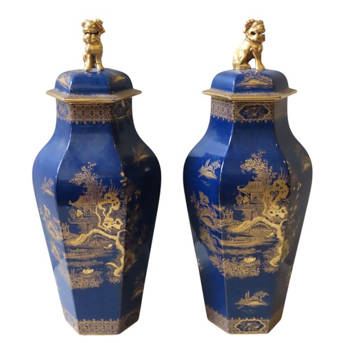 172 - A PAIR OF WILTON WARE HEXAGONAL BALUSTER JARS AND COVERS, the sides with gilt decoration depicting t... 