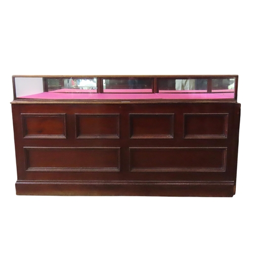 51 - A LARGE VINTAGE HABERDASHER'S SHOP COUNTER, the painted panelled pine base unit comprised of an arra... 