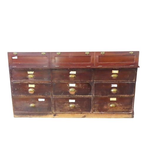 51 - A LARGE VINTAGE HABERDASHER'S SHOP COUNTER, the painted panelled pine base unit comprised of an arra... 