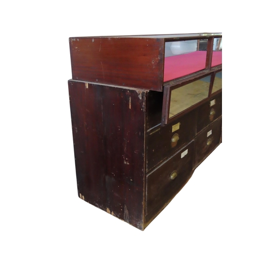 51 - A LARGE VINTAGE HABERDASHER'S SHOP COUNTER, the painted panelled pine base unit comprised of an arra... 