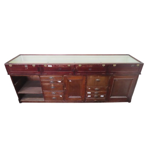 50 - A VINTAGE HABERDASHER'S SHOP COUNTER, pine and mahogany construction, with a glazed display counter ... 