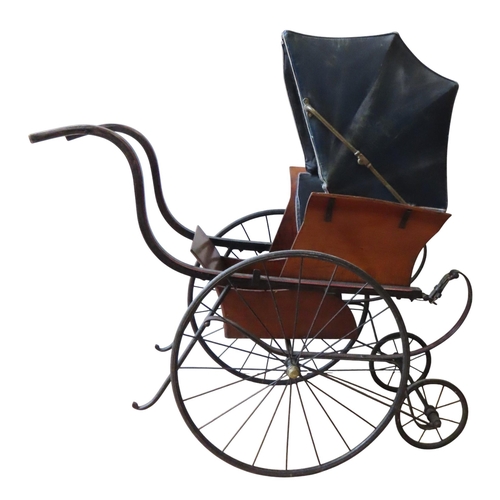 458 - A 19TH CENTURY CHILD'S PARK STROLLER BUGGY, the carriage with folding leather canopy, mounted on a s... 