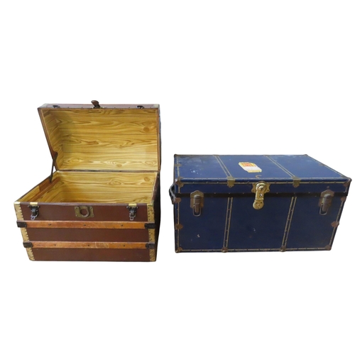 44 - A VINTAGE ENAMELLED TIN TRUNK AND A DOME TOP TRUNK, the tin covered trunk with vintage label attache... 