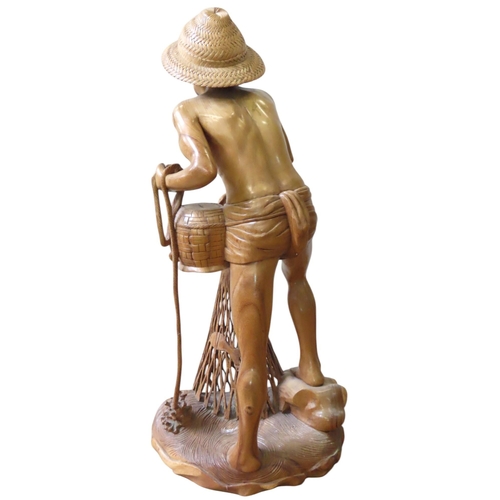 321 - A CHINESE CARVED HARDWOOD FLOOR STANDING FIGURE, 20TH CENTURY, depicting a fisherman hauling in his ... 