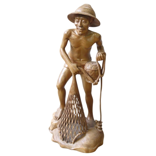 321 - A CHINESE CARVED HARDWOOD FLOOR STANDING FIGURE, 20TH CENTURY, depicting a fisherman hauling in his ... 