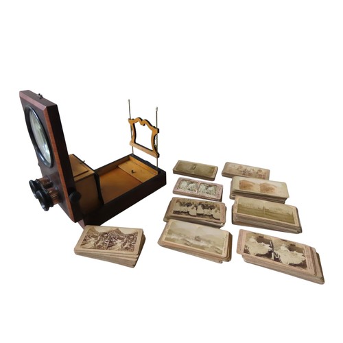 452 - A VINTAGE TABLE TOP STEREOSCOPE, LATE 19TH CENTURY, in a rectangular case, opening to reveal an ease... 