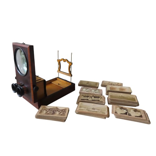 452 - A VINTAGE TABLE TOP STEREOSCOPE, LATE 19TH CENTURY, in a rectangular case, opening to reveal an ease... 