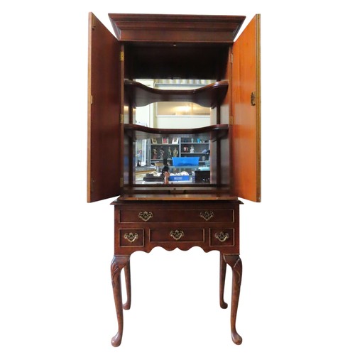 13 - A BURR WALNUT FRONTED CABINET ON STAND, 20TH CENTURY, in two sections, the top section with two pane... 