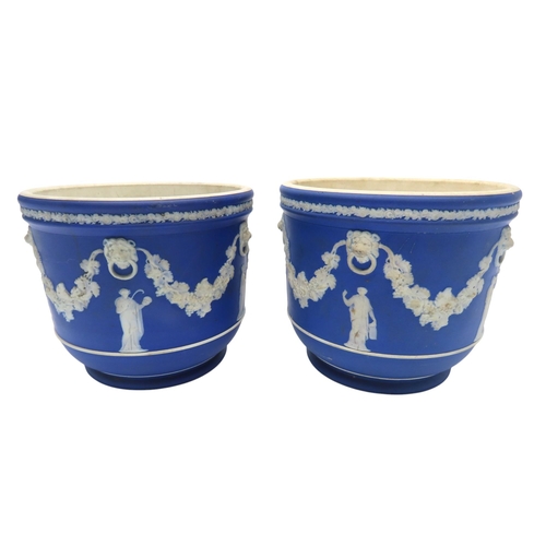 188 - A WEDGWOOD BLUE JASPER WARE SQUAT PEDESTAL AND A PAIR OF WEDGWOOD BLUE JASPER CACHE POTS21cm max... 