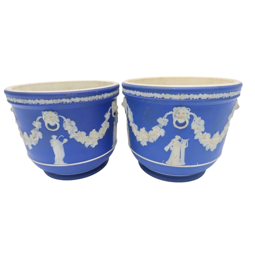 188 - A WEDGWOOD BLUE JASPER WARE SQUAT PEDESTAL AND A PAIR OF WEDGWOOD BLUE JASPER CACHE POTS21cm max... 