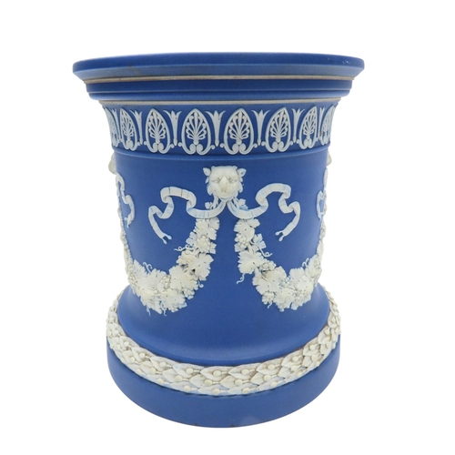 188 - A WEDGWOOD BLUE JASPER WARE SQUAT PEDESTAL AND A PAIR OF WEDGWOOD BLUE JASPER CACHE POTS21cm max... 