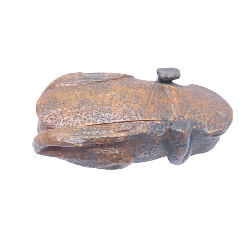 313 - A WOODEN SNUFF/TOBACCO BOX in the form of a toad, the base opening on a wooden hinge, the eyes inali... 