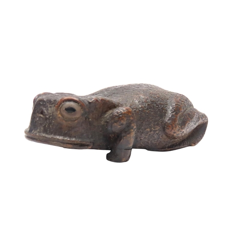 313 - A WOODEN SNUFF/TOBACCO BOX in the form of a toad, the base opening on a wooden hinge, the eyes inali... 