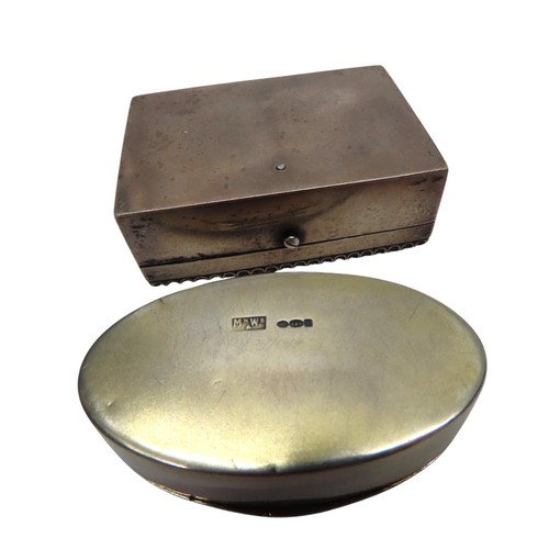 307 - A WHITE METAL 'PILL' BOX WITH GREEN AGATE INSET LID and an oval circular silver box with yellow enam... 