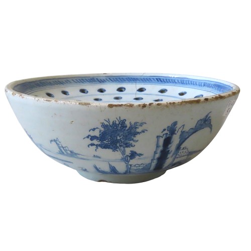 215 - RARE 18th CENTURY ENGLISH DELFT COLANDER the concentrically pierced top over a side aperture and pai... 