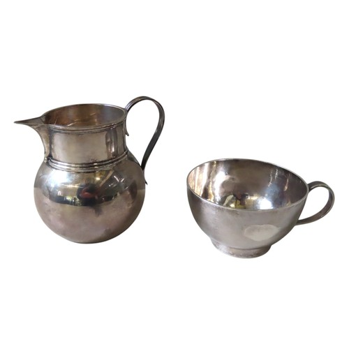 333 - A VINTAGE SILVER CREAMER AND WHITE METAL CUP, the globular form creamer marked Birmingham, 1918 (8 c... 