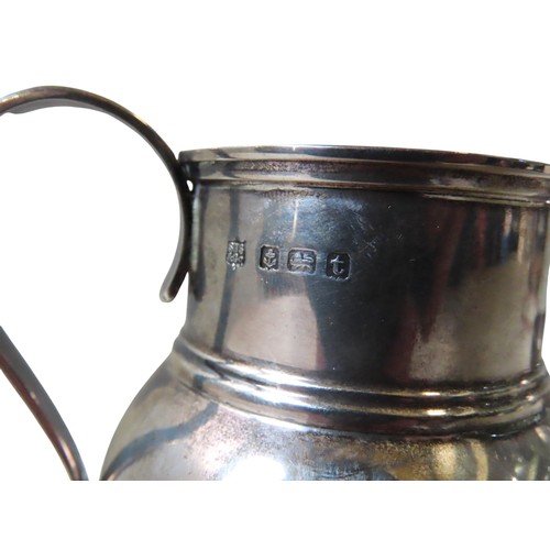 333 - A VINTAGE SILVER CREAMER AND WHITE METAL CUP, the globular form creamer marked Birmingham, 1918 (8 c... 