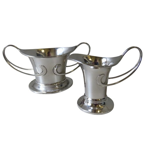 340 - AN ELEGANT SILVER ART NOUVEAU BOWL AND MATCHING CREAMER, both with scrolling handles, the bowl marke... 