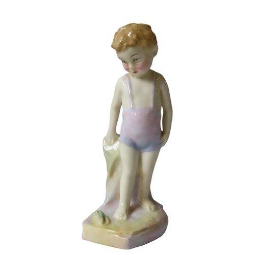 472 - A VINTAGE ROYAL DOULTON FIGURE OF CHILD, CIRCA 1938, modelled standing next to a sea shell, the base... 