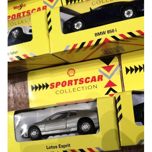 158 - A COLLECTION OF OVER 20 BOXED MODEL CARSIncluding 1:36 Maisto models for the Shell Sportscar colleci... 