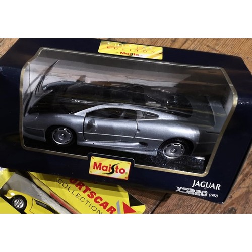 158 - A COLLECTION OF OVER 20 BOXED MODEL CARSIncluding 1:36 Maisto models for the Shell Sportscar colleci... 