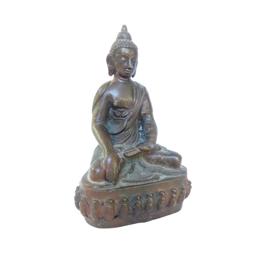 507 - A CAST BRONZE FIGURE OF BUDDHA, modelled in flowing robes, seated cross legged on a lotus form base1... 