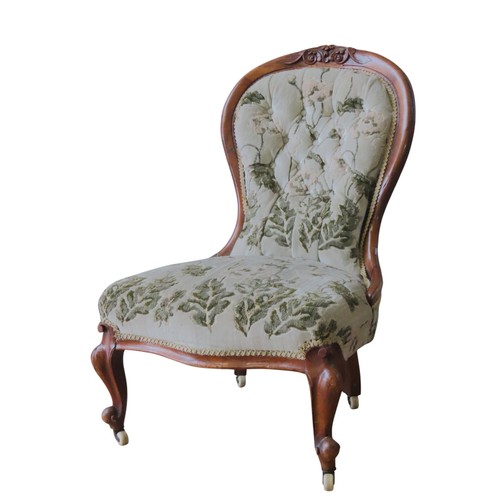 87 - A VICTORIAN MAHOGANY NURSING CHAIR, spoon back form, covered in a floral brocade fabric, raised on c... 