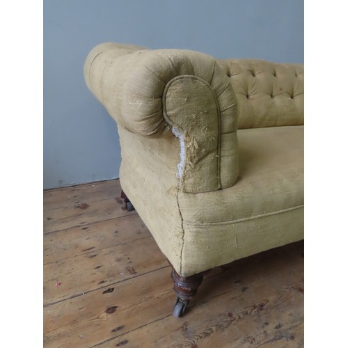 4 - A BUTTON UPHOLSTERED CHESTERFIELD SETTEE, LATE 19TH CENTURY, with scroll arms, covered in a gold dam... 