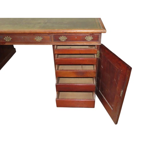 26 - A MID VICTORIAN MAHOGANY PARTNER'S DESK, the rectangular top inset with a gilt tooled leather writin... 