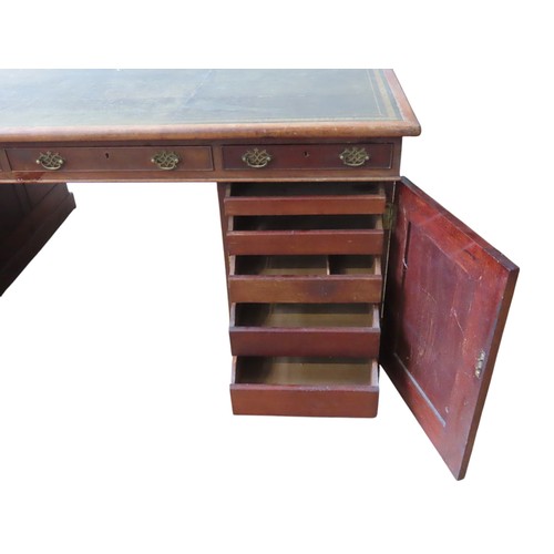 26 - A MID VICTORIAN MAHOGANY PARTNER'S DESK, the rectangular top inset with a gilt tooled leather writin... 