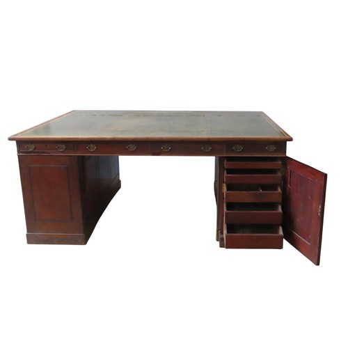 26 - A MID VICTORIAN MAHOGANY PARTNER'S DESK, the rectangular top inset with a gilt tooled leather writin... 