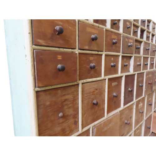 85 - A LARGE BANK OF PINE SEED MERCHANT'S DRAWERS, LATE 19TH CENTURY, in two sections, each section compr... 