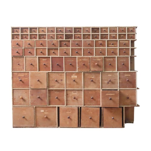 85 - A LARGE BANK OF PINE SEED MERCHANT'S DRAWERS, LATE 19TH CENTURY, in two sections, each section compr... 