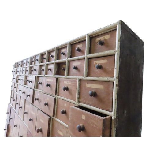 85 - A LARGE BANK OF PINE SEED MERCHANT'S DRAWERS, LATE 19TH CENTURY, in two sections, each section compr... 