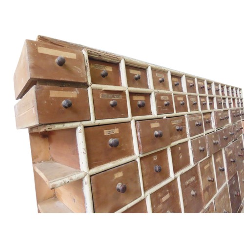 85 - A LARGE BANK OF PINE SEED MERCHANT'S DRAWERS, LATE 19TH CENTURY, in two sections, each section compr... 