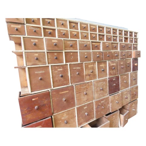 85 - A LARGE BANK OF PINE SEED MERCHANT'S DRAWERS, LATE 19TH CENTURY, in two sections, each section compr... 