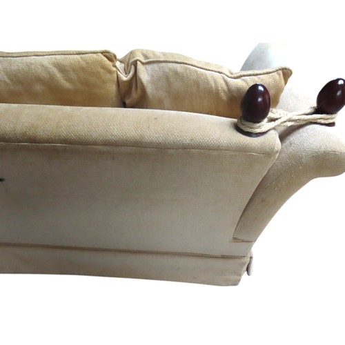 3 - A KNOLE-STYLE SETTEE, covered in a pale gold coloured fabric, with drop-down scroll armsHeight 90cm ... 