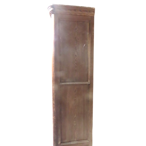 25 - A LARGE PINE BIBLIOTHEQUE, ogee cornice over three part glazed cabinet doors, raised on a plinth bas... 