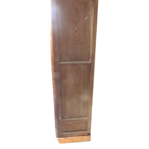 25 - A LARGE PINE BIBLIOTHEQUE, ogee cornice over three part glazed cabinet doors, raised on a plinth bas... 