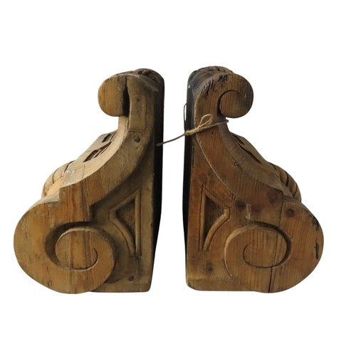 65 - A PAIR OF 19TH CENTURY CARVED PINE CORBELS, wide scrolling form with rope twist detailing44 x 40 x 2... 