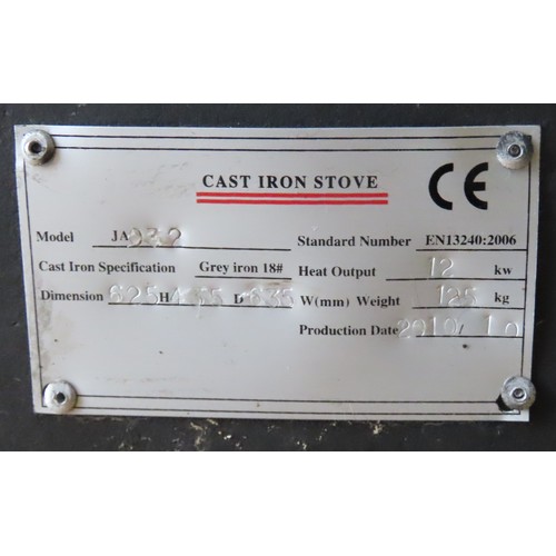 15 - A CONTEMPORARY CAST-IRON WOOD BURNING STOVE, model number JA032 (2010) with metal label affixed to t... 