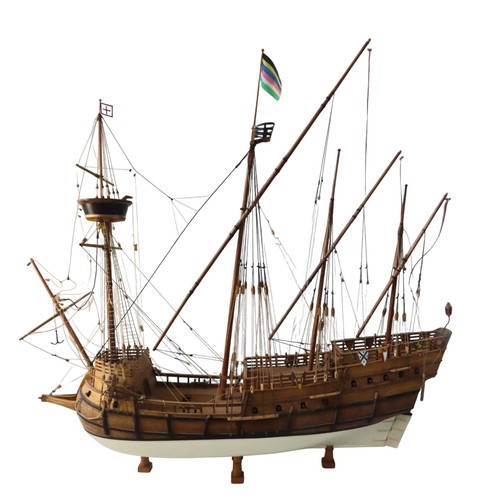 70 - A WOODEN MODEL OF A SPANISH 16TH CENTURY GALLEON, with four fully rigged masts and twenty two guns, ... 